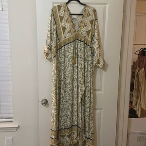 Maxi dress with floral like pattern on it. Brand new with tags! Size medium!
